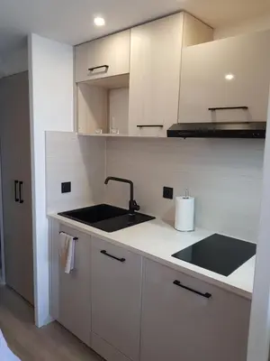 a kitchen with a sink and a counter top at Appartement en bord de mer in Cannes