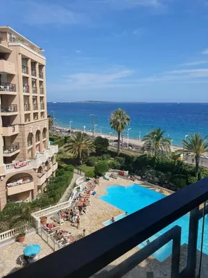 a view of the ocean from the balcony of a hotel at Appartement en bord de mer in Cannes