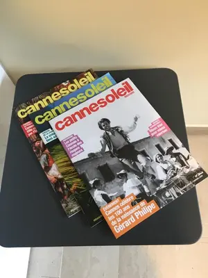 a magazine sitting on top of a table at Studette de Cannes in Cannes