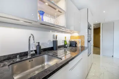 a kitchen with a sink and a counter top at CROISETTE - 2 Pièces rénové avec vue Mer in Cannes
