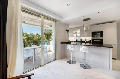 an open kitchen with a view of the ocean at CROISETTE - 2 Pièces rénové avec vue Mer in Cannes