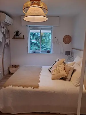 a bedroom with a large bed and a window at HENRI CAMILLE RE - Passy 2 -Beautiful one bedroom swimming pool and parking in Cannes