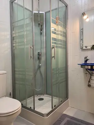 a bathroom with a shower and a toilet at Charming Villa-Appartement With A View On The Sea Of 95 M2 in Cannes