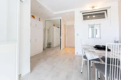 a kitchen and dining room with a table and chairs at Florida 35m studio with sea views close to the Croisette in Cannes