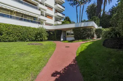 a red brick walkway in front of a building at Studio A/C La Californie with patio by Olidesi in Cannes