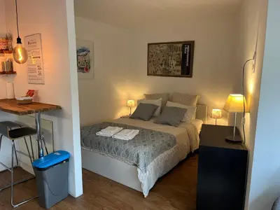 a small bedroom with a bed and a desk at Fantastic located studio in Cannes
