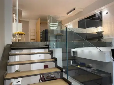 a staircase in a room with a glass wall at Sunflower apartments in Cannes