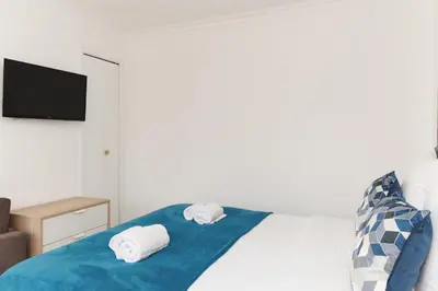 a bedroom with a bed with towels on it at Bleu Croisette YourHostHelper in Cannes