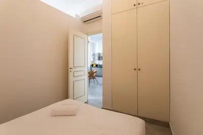 a bedroom with a bed and a closet at Freres PradignacLAT1101 in Cannes