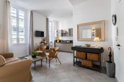 a living room with a couch and a table at Freres PradignacLAT1101 in Cannes
