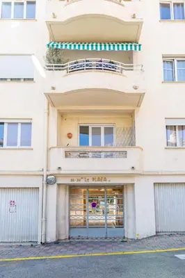 an apartment building with the front door open at IMMOGROOM - Renovated - Terrace - Air conditioning - Quiet - Carnot in Cannes