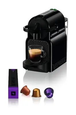 a coffee maker with a cup of coffee at CHESTER Riviera Escape - Appartement calme, terrasse & clim proche Croisette et centre in Cannes
