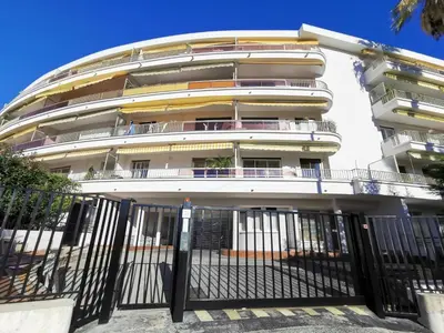 a building with a fence in front of it at CHESTER Riviera Escape - Appartement calme, terrasse & clim proche Croisette et centre in Cannes