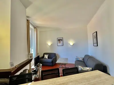 a living room with a couch and a chair at Cannes Suquet by Welcome to Cannes in Cannes
