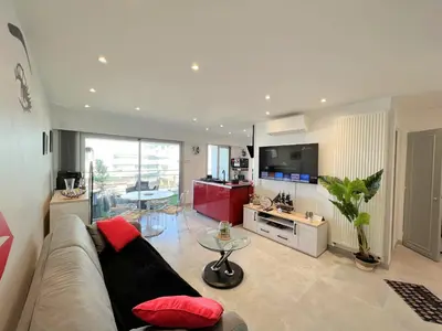 a living room with a couch and a table at Maryline by Welcome to Cannes in Cannes