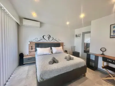 a bedroom with a bed with two pillows on it at Maryline by Welcome to Cannes in Cannes