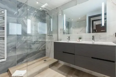 a bathroom with two sinks and a shower at Résidence Topaze - Central - Luxurious - 50m Croisette Palais - LRA CANNES in Cannes