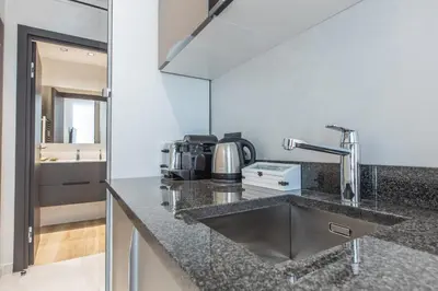 a kitchen with a sink and a counter top at Résidence Topaze - Central - Luxurious - 50m Croisette Palais - LRA CANNES in Cannes
