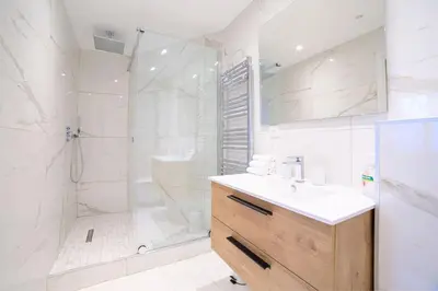 a bathroom with a shower and a sink and a toilet at L'Elégance Hoche - Congrès Palais - Plage Croisette - Cannes Centre - Clim in Cannes