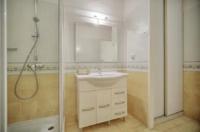 a bathroom with a sink and a shower at Super Central Cannes - all comfort - Calm in Cannes
