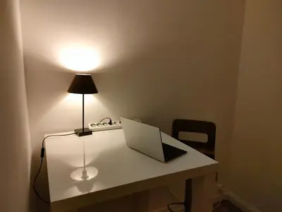 a desk with a laptop and a lamp on it at 3 rooms, 2 bathrooms, in a villa. Lightfull, quiet and charm in Cannes