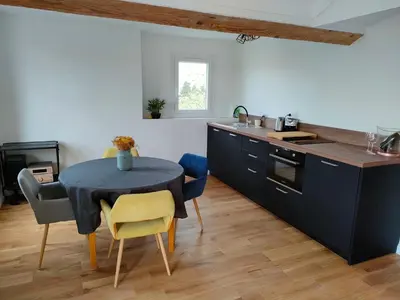 a kitchen with a blue table and chairs in a room at 3 rooms, 2 bathrooms, in a villa. Lightfull, quiet and charm in Cannes
