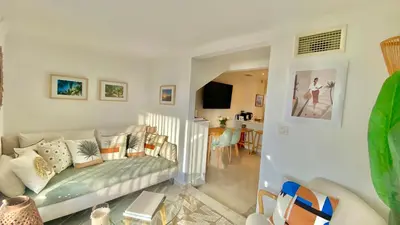 a living room with a couch and a table at LOFT CROISETTE VUE Mer in Cannes