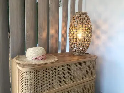 a vase and a hat sitting on top of a table at LOFT CROISETTE VUE Mer in Cannes