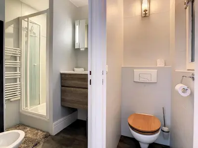 a bathroom with a toilet and a sink at 2 Bedroom luxury flat Cannes Center La Croisette in Cannes