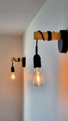 a couple of lights hanging from a wall at Appartement bord de mer in Cannes