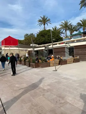 a man riding a skateboard in a parking lot at Appartement bord de mer in Cannes