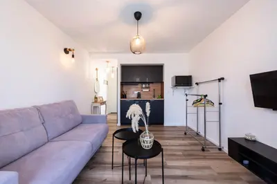 a living room with a couch and a table at Appartement bord de mer in Cannes