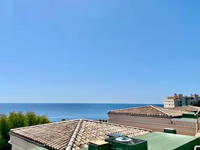 a view of the ocean from the roofs of buildings at Les Ingres By SCLS Locations in Cannes