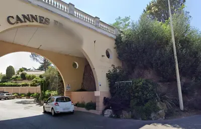 a car parked in a parking lot in front of a building at Les Ingres By SCLS Locations in Cannes