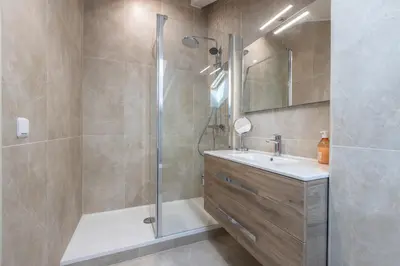 a bathroom with a shower and a sink at LB Vacation Rentals I Duplex Commandant Andre 65m2 I Casa d'Azur in Cannes