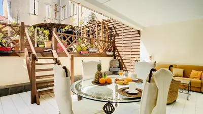 a dining room with a glass table with fruit on it at Cannes : superbe terrasse rue d'Antibes in Cannes