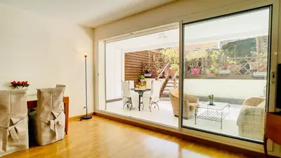 a living room with a large sliding glass door at Cannes : superbe terrasse rue d'Antibes in Cannes