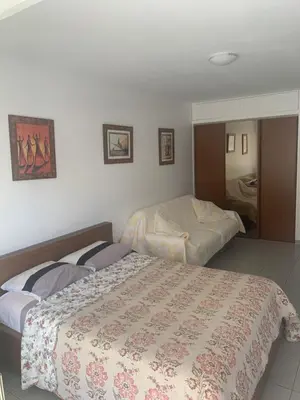 a bedroom with two beds and a bathroom at ÉVÈNEMENTS CANNES in Cannes