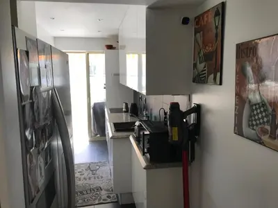 a kitchen with a sink and a counter top at ÉVÈNEMENTS CANNES in Cannes