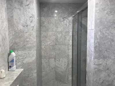 a shower with a glass door in a bathroom at ÉVÈNEMENTS CANNES in Cannes