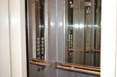 a row of metal lockers in a building at Palais Lumière in Cannes