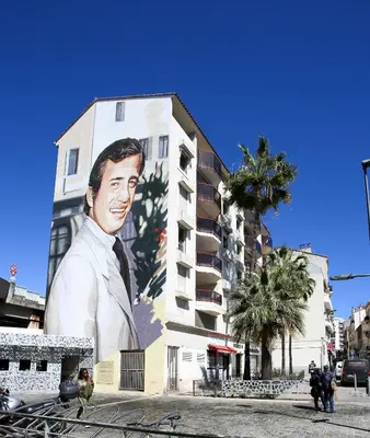 a large mural of a man on the side of a building at Cannes Studio Centre GAMBETTA in Cannes