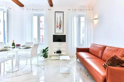 a living room with a couch and a table at Alba apartment antibes street, by Welcome to Cannes in Cannes