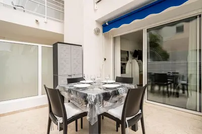 a black table and chairs on a patio at LE ROYAL Studio adorable avec terrasse, parfait pour les couples et à deux pas de la Croisette in Cannes