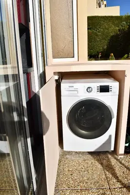 a washer and dryer in a house at Magnifique Appartement 2 pièces au calme in Cannes