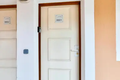 a white door with the numbers on it at Résidence Cannes Villa Francia - maeva Home - Studio 4 personnes - Confort MAE-9944 in Cannes