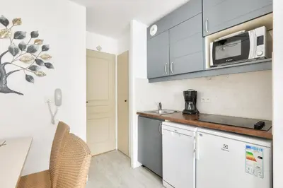 a kitchen with a counter top and a microwave at Résidence Cannes Villa Francia - maeva Home - Studio 4 personnes - Confort MAE-9944 in Cannes