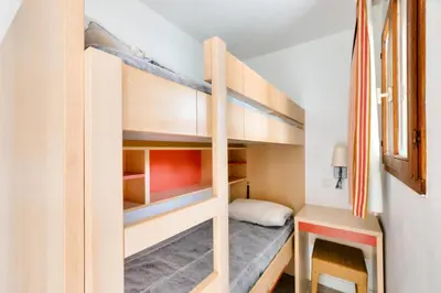 a bunk bed in a small room with a ladder at Résidence Cannes Villa Francia - maeva Home - Studio 4 personnes - Confort MAE-9944 in Cannes