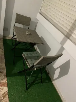 a table and a chair and a table and a table and chairs at bien-être in Cannes