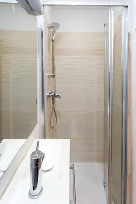 a bathroom with a shower and a sink at Cannes Hyper Centre climatisé in Cannes